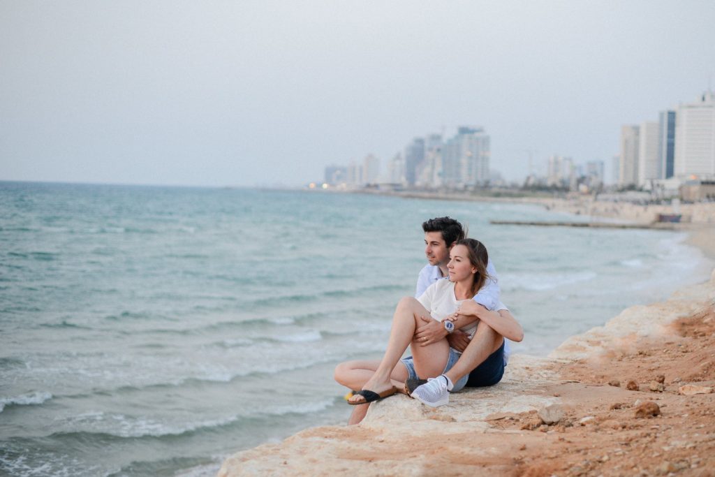 seated couple on the beach in Neve Tzedek