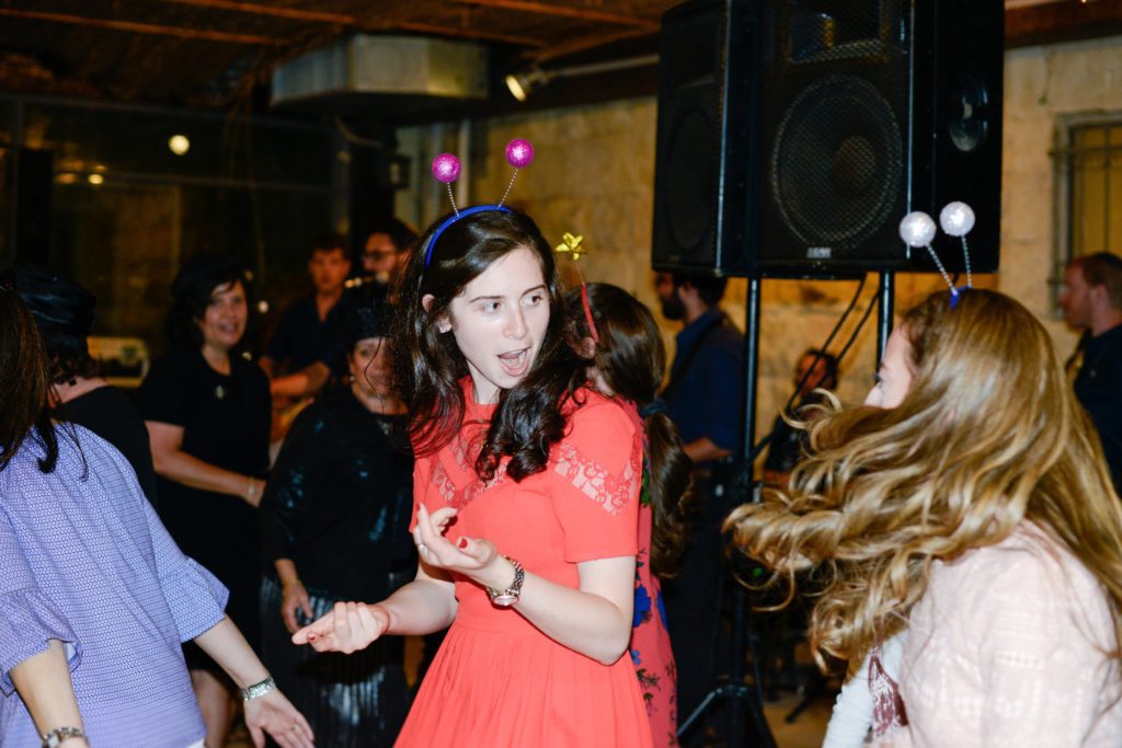 woman in costume dancing at wedding