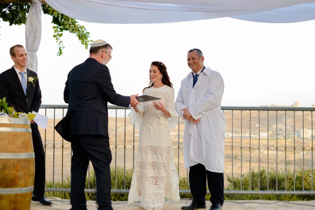 bride and groom at outdoor desert wedding ceremony