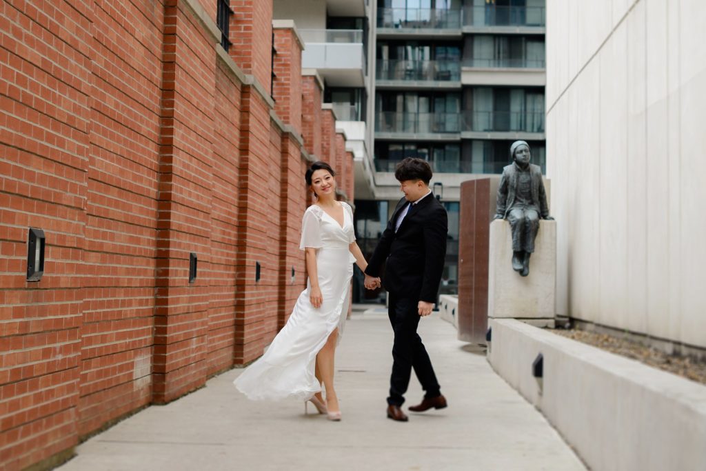 smiling and posing bride and groom couple at wedding photoshoot