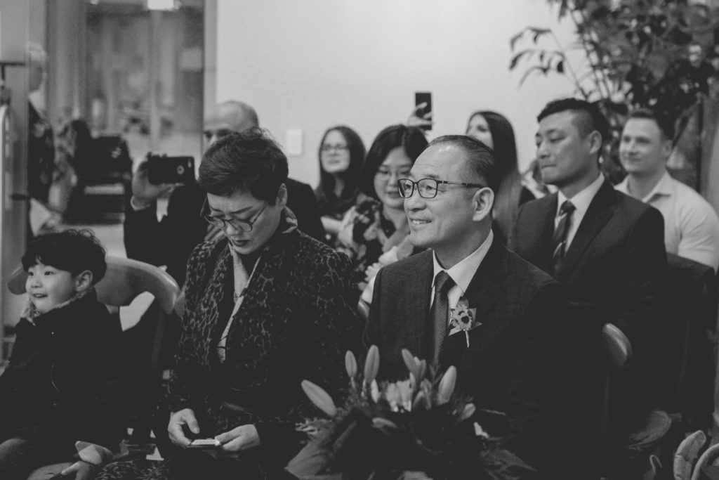 black and white photo of guests at wedding