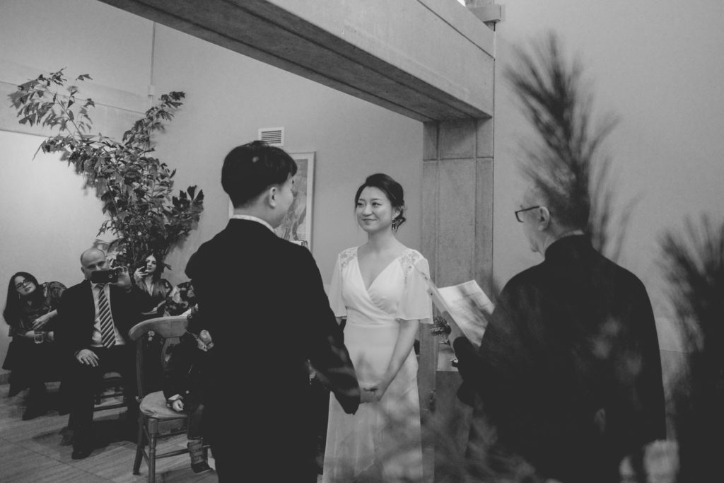 couple in toronto city hall wedding ceremony photoshoot