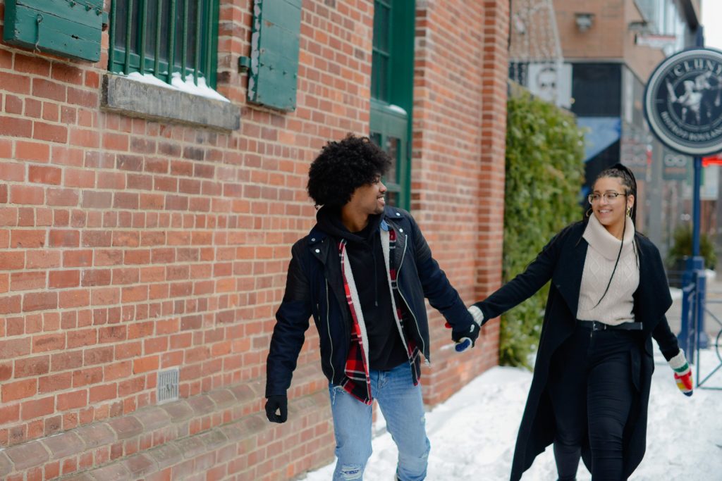 toronto couple smiling and holding hands