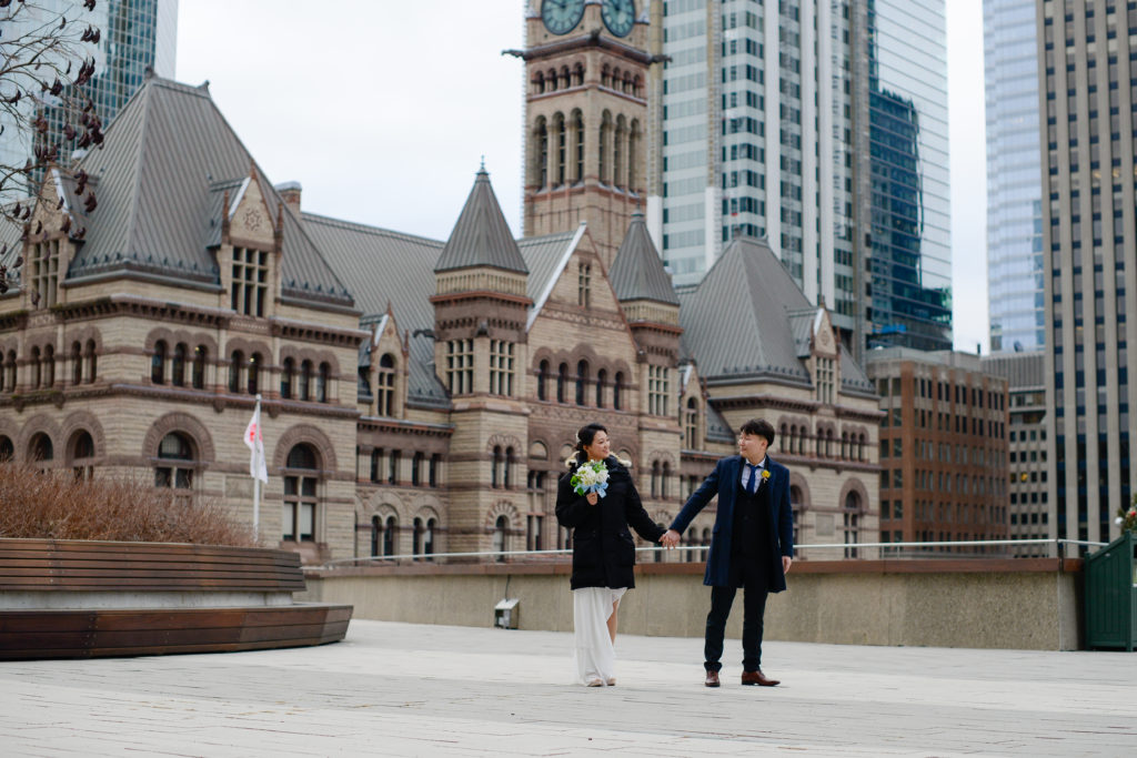 bridal couple in front of toronto's city hall