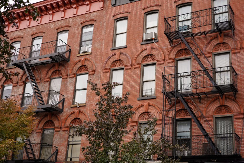 red brick brooklyn session buildings with fire escapes in new york city