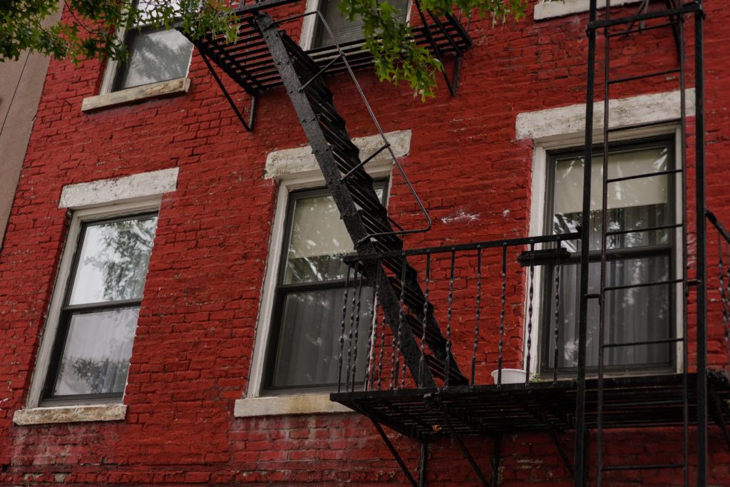 Brooklyn sessions photo of red brick building with fire escape