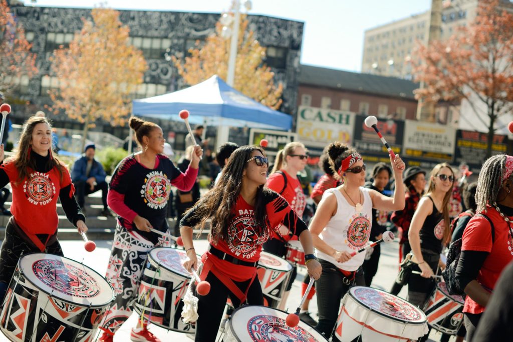 Women musicians playing drums in the streets of Brooklyn - Lauren Newman Photography