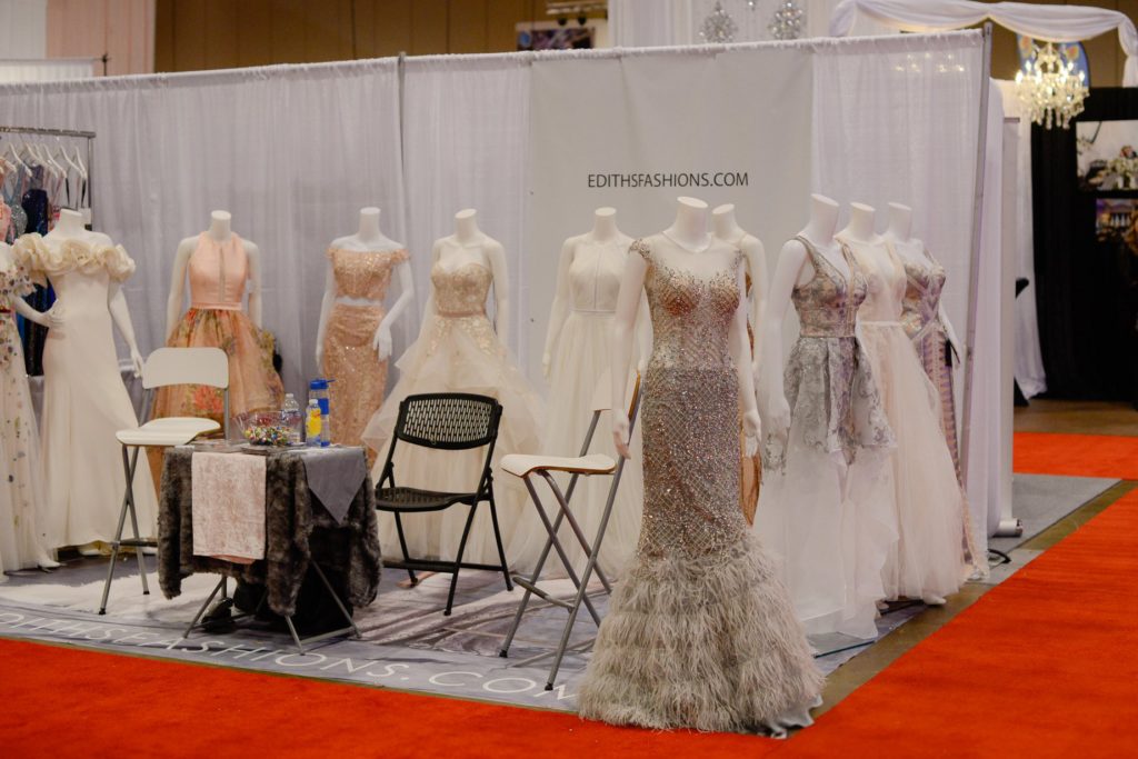 several wedding and bridesmaid dresses on mannequins at Canada's Bridal Show 2019